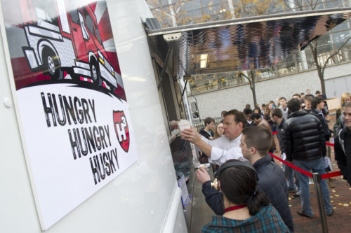 Northeastern’s food truck, named “Hungry Hungry Husky,” served about 200 students at lunch on Monday, its first day in business. <i>Photo by Mary Knox Merrill/Northeastern University</i>