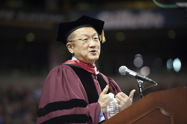 Jim Yong Kim in Commencement regalia, speaking at the podium