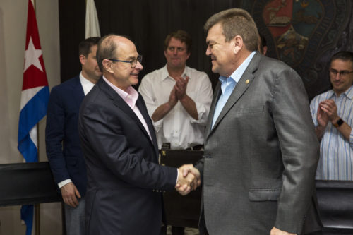 Northeastern University President Joseph E. Aoun, left, shakes hands with Gustavo José Cobreiro Suárez, rector of the University of Havana, at the agreement signing. <i>Noah Friedman-Rudovsky for Northeastern University</i>