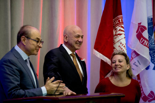 At Northeastern's Veterans Day ceremony on Friday, President Joseph E. Aoun, left, acknowledged Jim and Leslie Dolce, whose family has made a $1 million gift to endow and name the Center for the Advancement of Veterans and Servicemembers. <i>Photo by Matthew Modoono/Northeastern University</i>