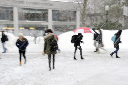 Students navigate campus during a snow storm in 2015. Photo by Matthew Modoono/Northeastern University