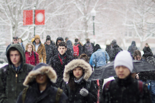 Students walk through campus during a snowstorm on March 21, 2016. Photo by Adam Glanzman/Northeastern University