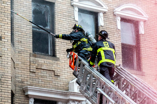 Firefighters work to control the multi-alarm fire at 104 Hemenway St. on Oct. 27, 2018. Photos by Lauren Scornavacca for Northeastern University