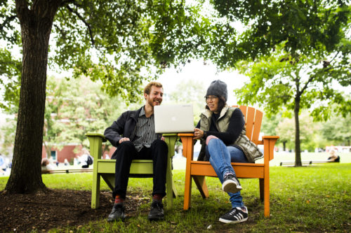 Julia Hechtman, assistant teaching professor in the College of Arts, Media and Design, talks with student Nicholas Korb Bond on Centennial Common in September. Photo by Adam Glanzman/Northeastern University
