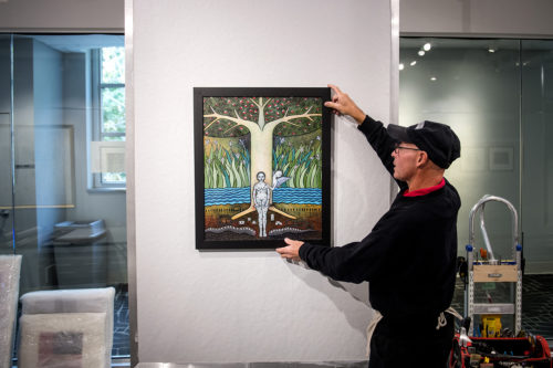 Cuban artwork loaned from Maria Lopez is installed in Gallery 360 on Oct. 23, 2018. Photo by Matthew Modoono/Northeastern University