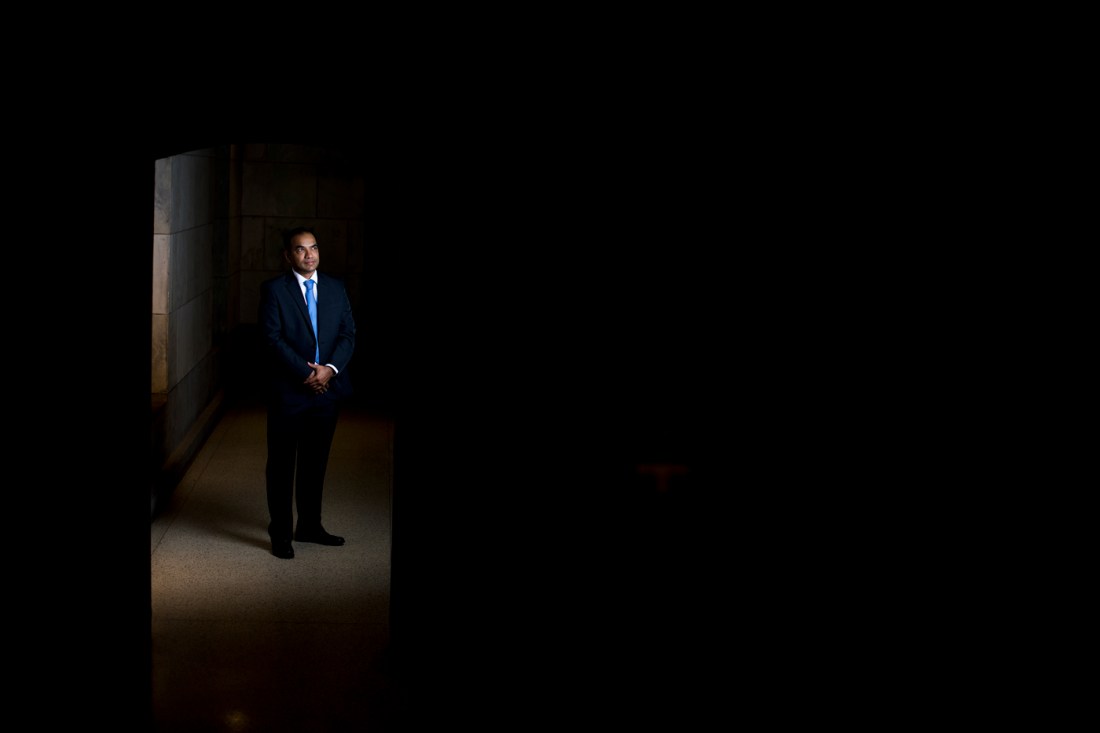 Ganeshsingh Thakur standing in a dimly lit doorway.