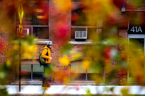 A person walks past Holmes Hall on Nov. 15, 2018. Photo by Matthew Modoono/Northeastern University