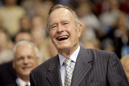 Former President George H.W. Bush smiles as he arrives at the Republican National Convention in St. Paul, Minnesota, on Tuesday, Sept. 2, 2008. (AP Photo/Jae C. Hong)