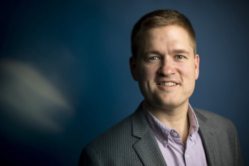 “We haven’t even come close to explaining why the world is the way it is,” James Halverson says. “But we demonstrated a selection mechanism that could someday be an important piece of the final answer.” Photo by Adam Glanzman/Northeastern University