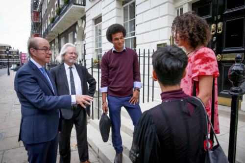 Northeastern President Joseph E. Aoun, left, and NCH Founder and Master Anthony Grayling talk to students on the campus in London on Thursday, Sept. 19, 2018. Photo by Suzanne Plunkett for Northeastern University