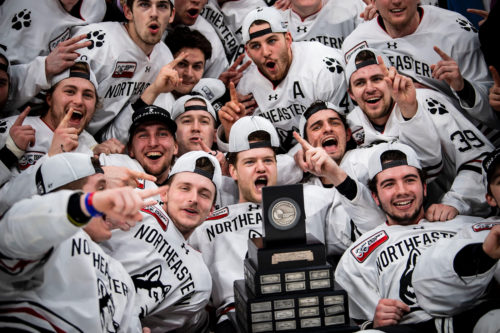 The Huskies celebrate their latest triumph after winning the Hockey East Tournament on Saturday with a 3-2 win over Boston College at TD Garden.  Photo by Billie Weiss/Northeastern University