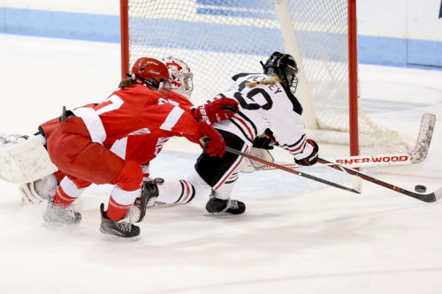 Northeastern’s Veronika Pettey lunges for the puck en route to scoring Northeastern’s first goal of the game in the third period. Photo by Jim Pierce for Northeastern University