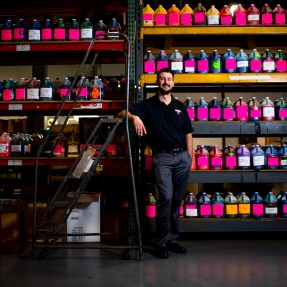 “I never knew I was gonna end up in a label business,” says Ryan Dunlevy, a Northeastern graduate who started working for his family’s custom label company following a brief stint in the technology field. Photo by Matthew Modoono/Northeastern University