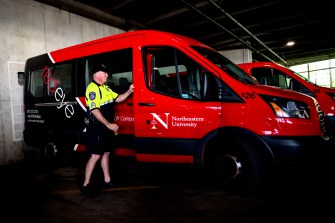 NUPD Sgt. John Farrell drives the RedEye safety escort van. Photo by Matthew Modoono/Northeastern University