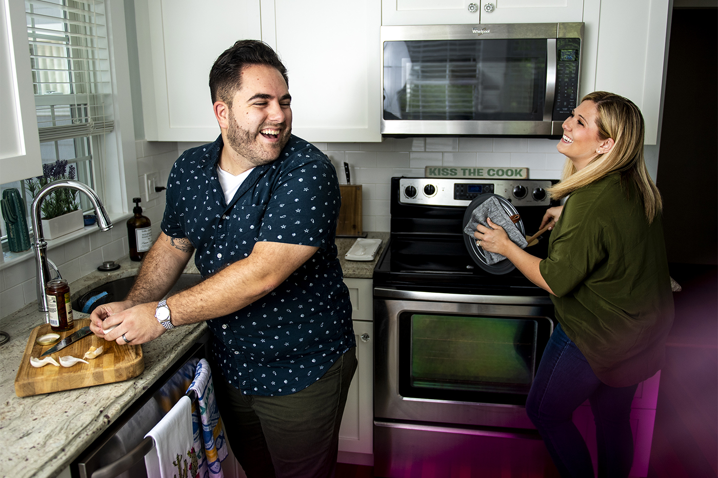 Northeastern graduates Kenzie Swanhart and Julien Levesquev say that their culinary partnership was built in the kitchen of a small apartment in Boston’s Fenway neighborhood. Now the duo is about to release The New Newlywed Cookbook: 100 Recipes for Every Couple to Cook Together to unite people through the joys of cooking and eating. Photo by Ruby Wallau/Northeastern University