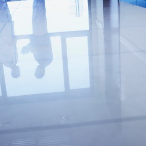 stock image of people standing on a hospital-like floor