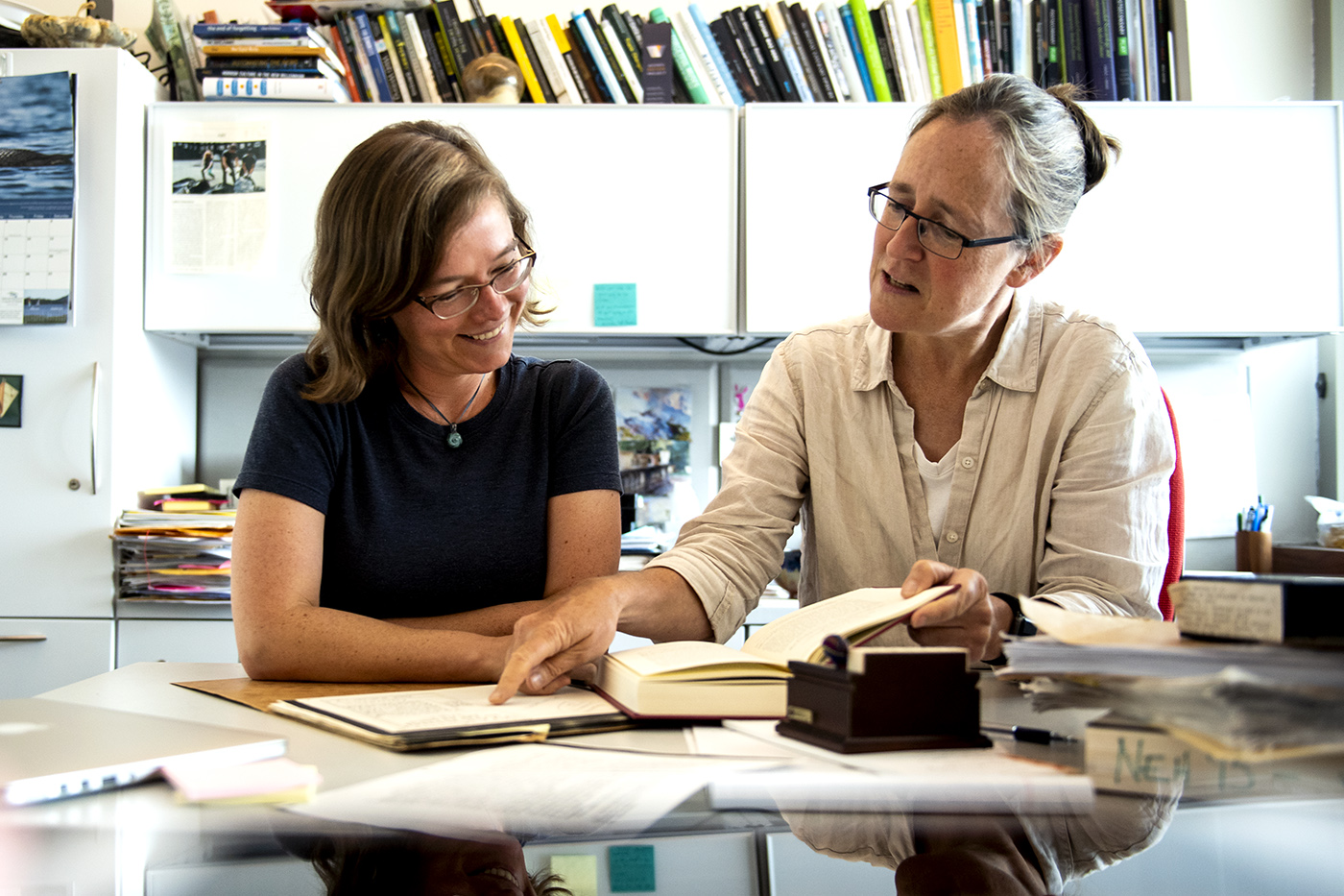 Northeastern’s Women Writers Project posthumously gives women a voice by transcribing and republishing their long-forgotten writing from the 1500s to the 1850s. Assistant director, Sarah Connell, and director and professor of practice in English, Julia Flanders, compare their transcription to an original text. Photo by Ruby Wallau/Northeastern University