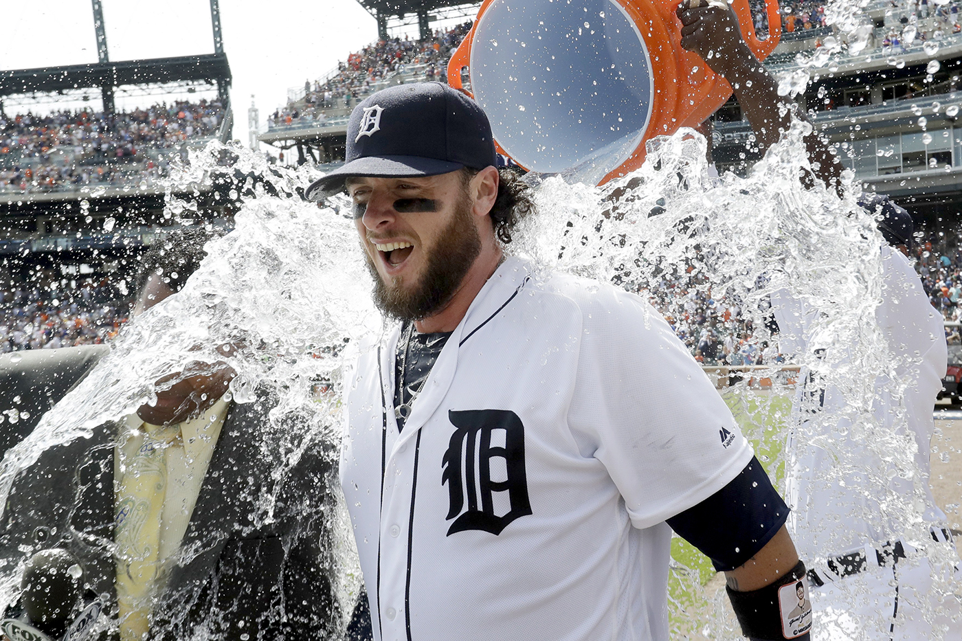 Detroit Tigers' Jarrod Saltalamacchia is celebratorily doused during a post game interview