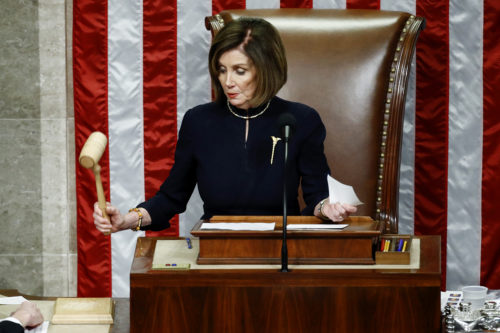 House Speaker Nancy Pelosi strikes the gavel after announcing the passage of article II of impeachment against President Donald Trump, (AP Photo/Patrick Semansky)
