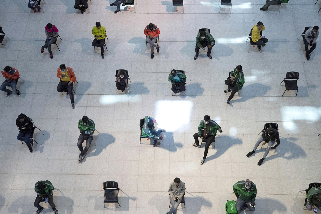 Shot of shoppers on spread-out chairs to prevent coronavirus spread