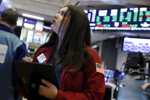 Trader Ashley Lara works on the floor of the New York Stock Exchange on Feb. 5, 2020. AP Photo/Richard Drew, File