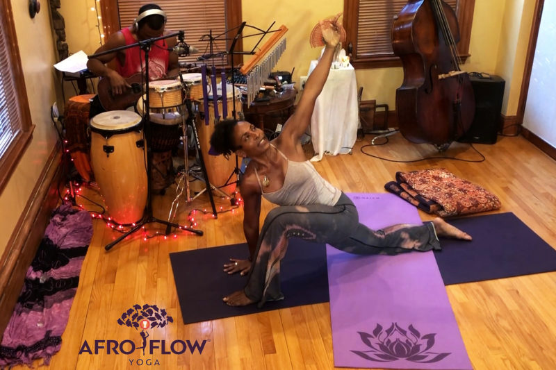 Leslie Salmon-Jones leads a virtual session of Afro Flow Yoga, a combination of West African dance and traditional yoga, while Jeff Jones, her husband, plays accompaniment on a ukulele and drums. Afro Flow Yoga is one of two virtual programs still offered by Northeastern Crossing. Photo courtesy of Afro Flow Yoga