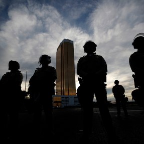 Silhouette of a line of police officers