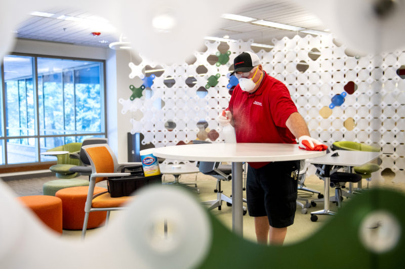 A member of the Northeastern facilities team sanitizes and cleans Snell Library. Photo by Matthew Modoono/Northeastern University