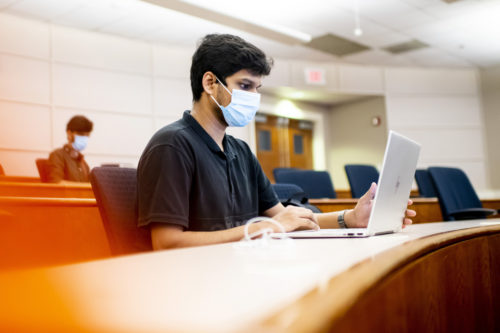 Sahil Bagwan, a graduate student in the school of engineering, participates in a demonstration of a NUflex Auto classroom where students attend both in person and online. Photo by Ruby Wallau/Northeastern University