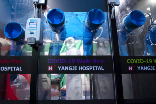 Medical worker in South Korea disinfects single-person COVID-19 testing facility