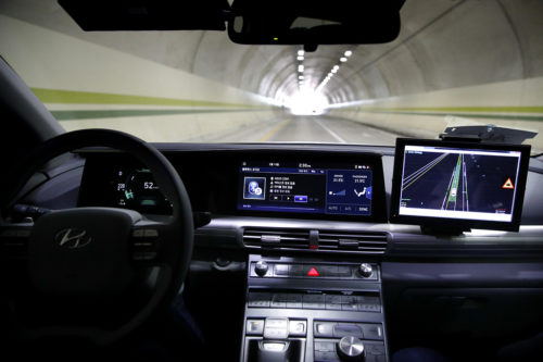Hyundai's autonomous fuel cell electric vehicle Nexo is driven through a tunnel near the Pyeongchang Olympic Stadium in Pyeongchang, South Korea. At Pyeongchang Winter Olympic Games. AP Photo by Jae C. Hong