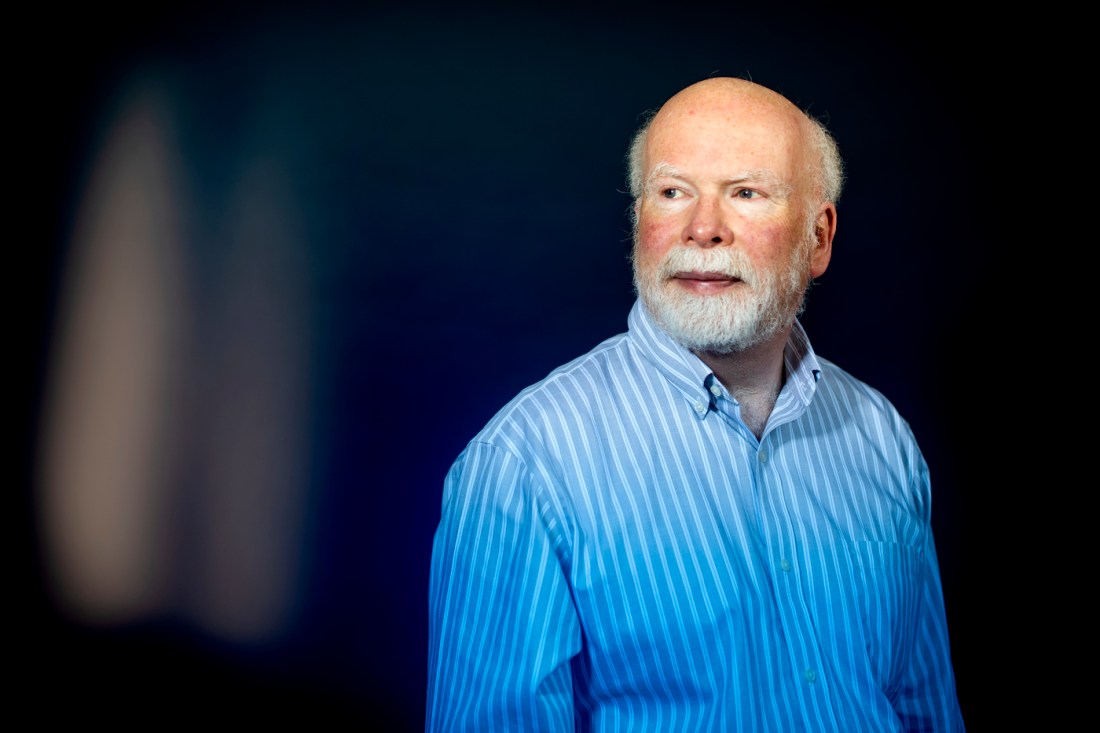 Portrait of Bob Triest wearing a striped shirt. 
