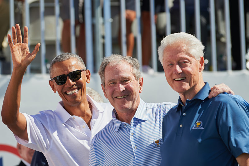 Presidents Obama, G.W. Bush, and Bill Clinton smile and wave while on the first tee during the first round of the Presidents Cup at Liberty National Golf Club on September 28, 2017 in Jersey City, New Jersey. AP Photo by Shelley Lipton/Icon Sportswire