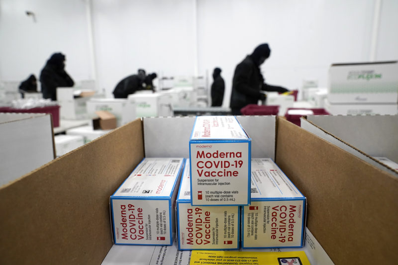Boxes containing the Moderna COVID-19 vaccine are prepared to be shipped at the McKesson distribution center in Olive Branch, Miss., Sunday, Dec. 20, 2020. AP Photo by Paul Sancya, Pool