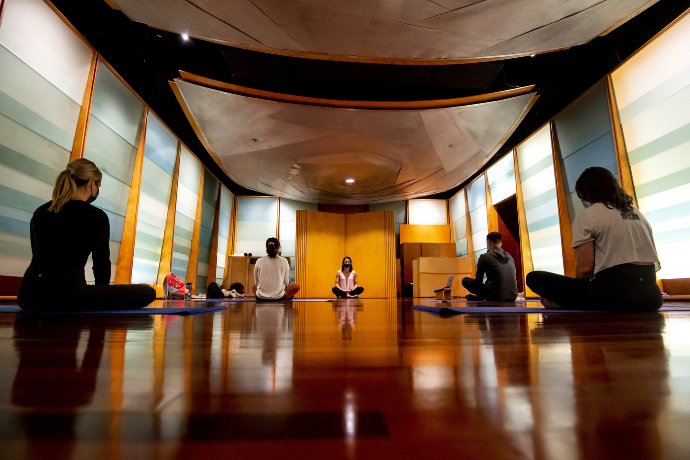 Laura Dudley, assistant clinical professor of applied psychology, teaches yoga during an Introduction to Mindfulness class in the Sacred Space.