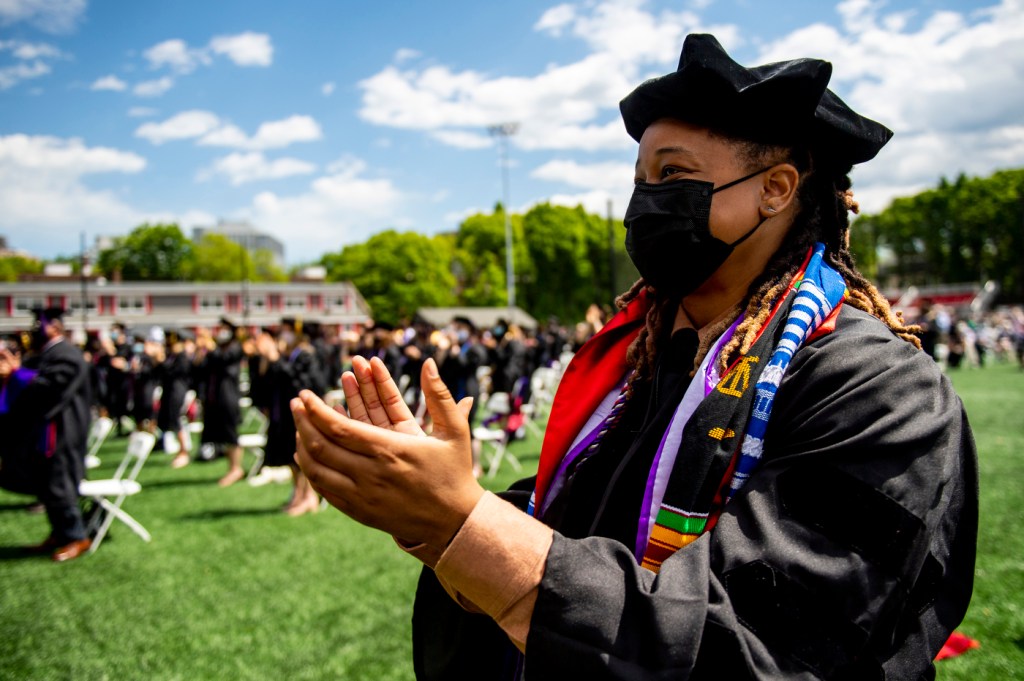 Student clapping during Commencement ceremony