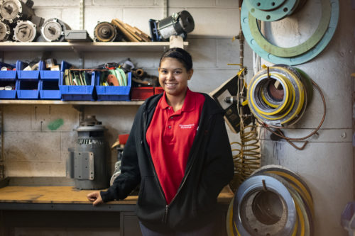 Olivia Gerena, a Madison Park Technical school student who is working as a plumbing apprentice on campus at Northeastern University, poses for a portrait.