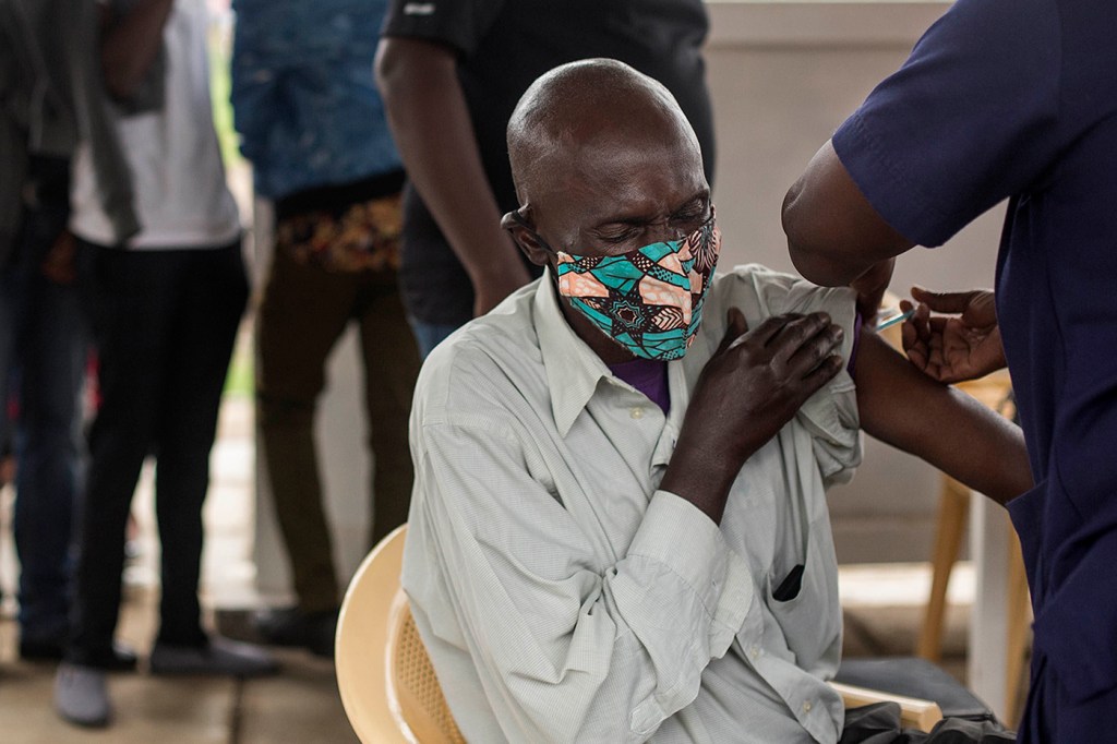 A person in Kenya receives the COVID-19 vaccine.