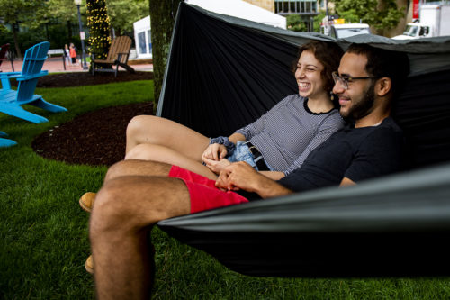 Northeastern computer science major Rebecca Swernofsky and Nour Hussein catch up in a hammock during Hussein’s visit to campus. Photo by Alyssa Stone/Northeastern University