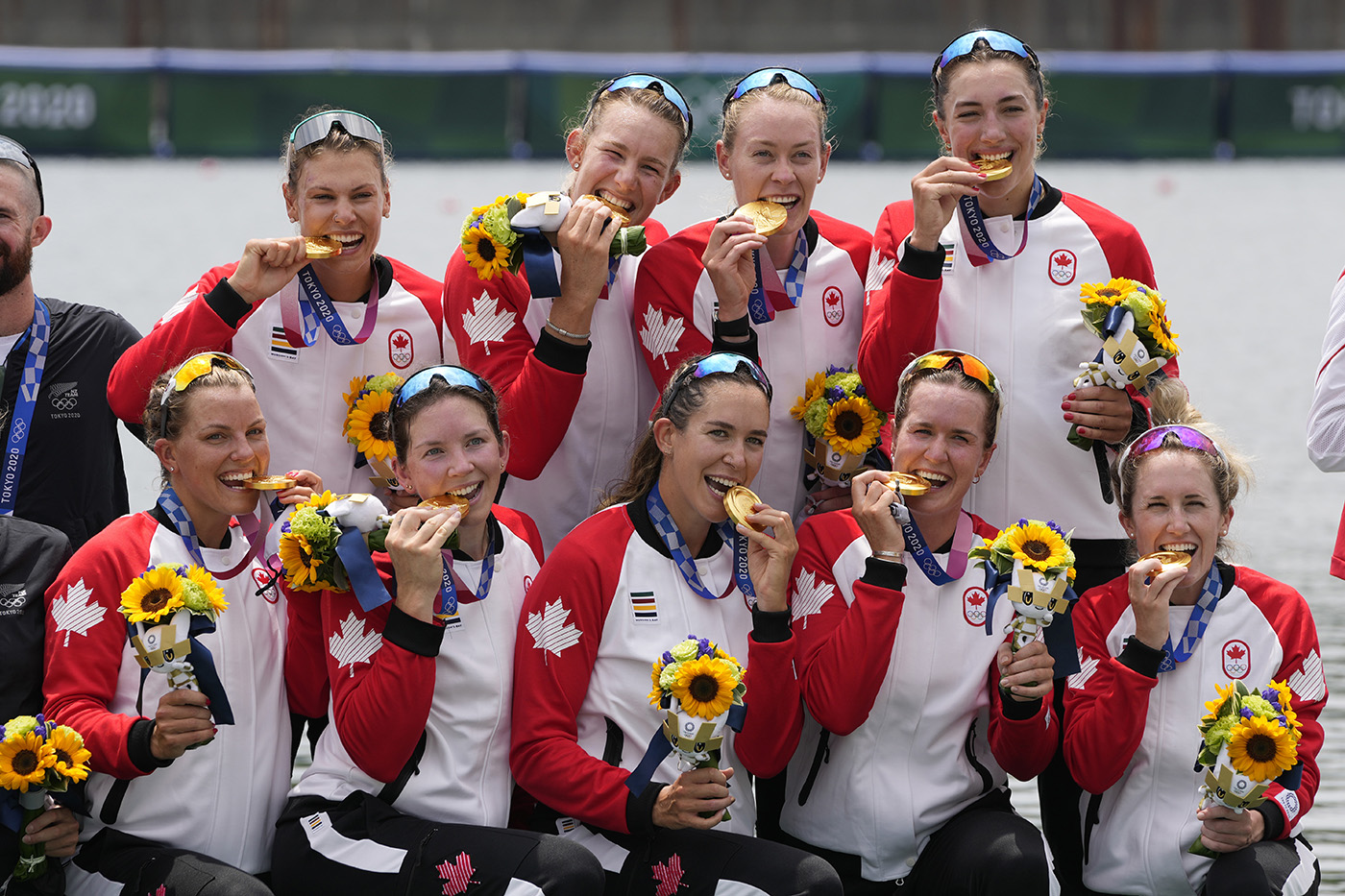 The Canadian rowing team in the women's eight celebrates its gold medal at the Tokyo Olympics.