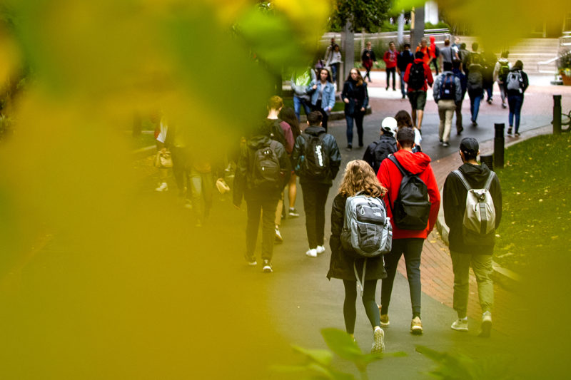 Members of the Northeastern community walk around the Boston campus in the fall. The university announced on Monday that faculty and staff based in the United States will need to submit verification of vaccination by Sept. 8, 2021.