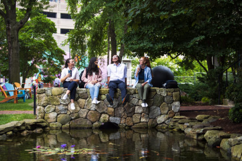 08/04/21 - BOSTON, MA - Northeastern University students Hayley Reifeiss, Kemelly Fortunati, Benjamin Calitri and Samantha Sinclair relax at the coy pond on Wednesday, August 4, 2021. Photo by Alyssa Stone/Northeastern University