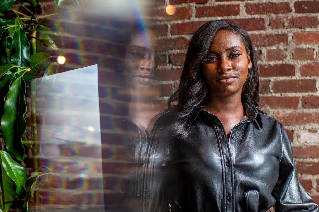 Northeastern graduate Camille Martin poses for a portrait at The Engine in Cambridge, Mass.