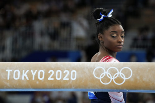 Simone Biles, of the United States, prepares to start her performance on the balance beam during the artistic gymnastics women's apparatus final at the 2020 Summer Olympics.