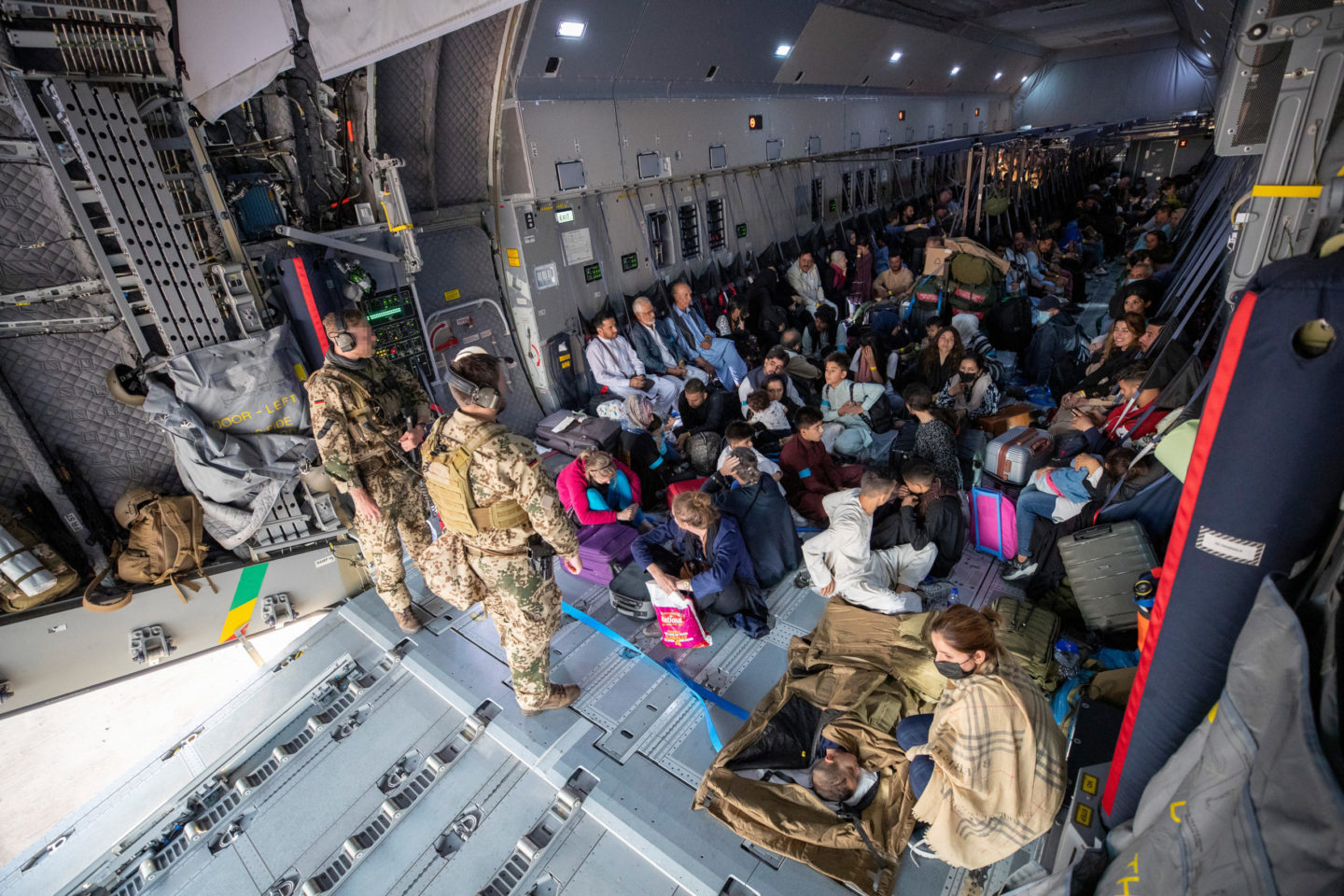 Afghan refugees on a military plane