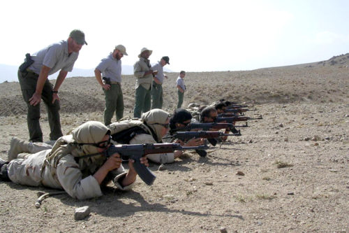Philip McTigue trains Afghan police officers in weapons training and basic marksmanship skills outside of Kabul in 2008. Photo courtesy of Phil McTigue.
