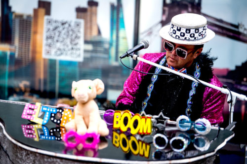 Elton John impersonator performs outside the Curry Student Center in Snell Quad during the London Festival on Sept. 15, 2021. Photo by Matthew Modoono/Northeastern University