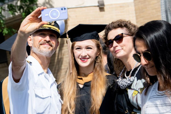 northeastern graduate takes selfie with her family