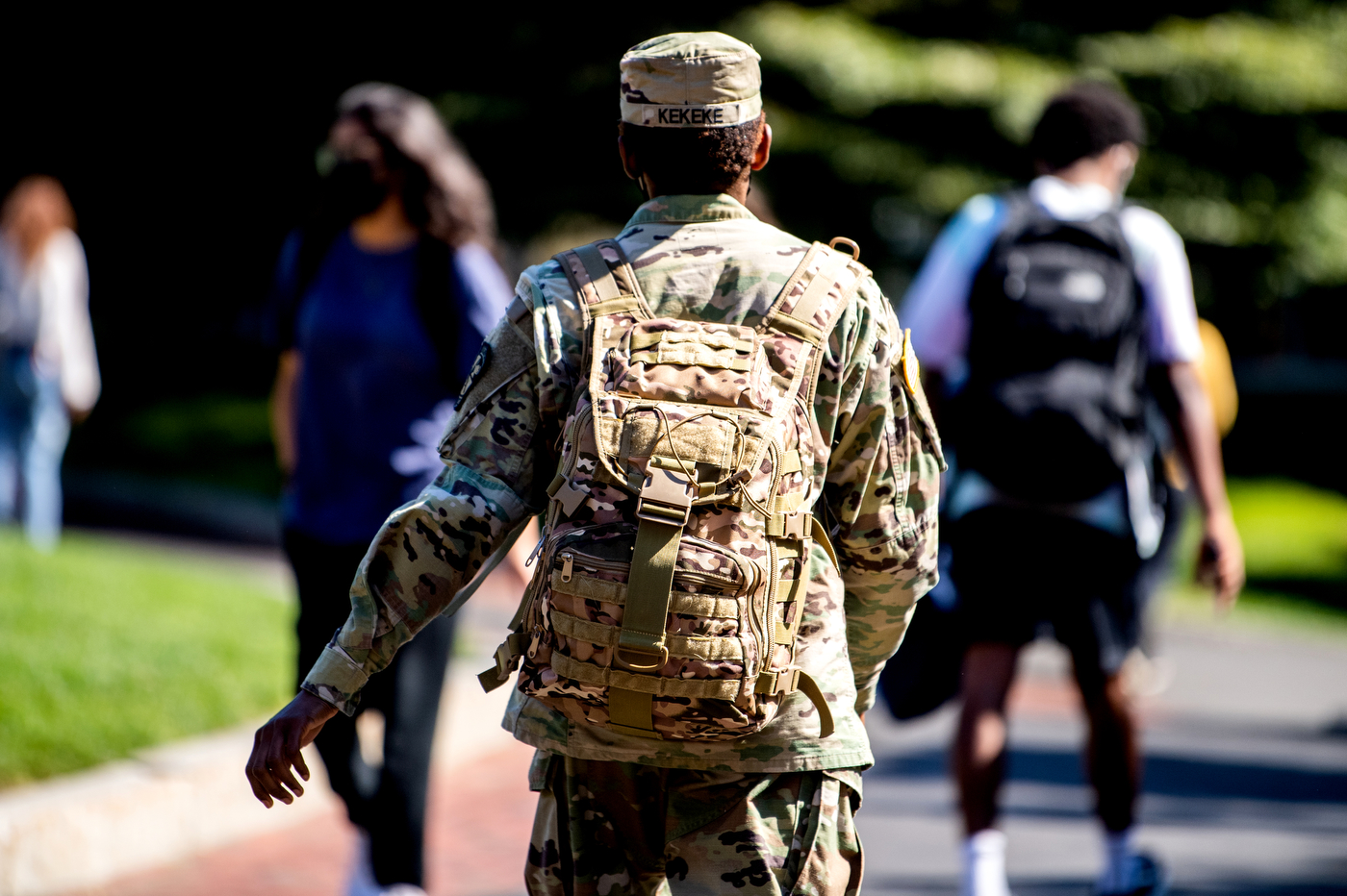 north east rotc student walking through campus