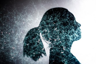 silhouette of a womans head with blue neuro map overlaid